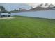 Large backyard with a white fence at 306 Clermont Dr, Kissimmee, FL 34759