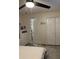 Bedroom featuring a ceiling fan, closet, and storage cabinets at 306 Clermont Dr, Kissimmee, FL 34759