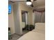 Comfortable bedroom with ceiling fan, closet, and ample natural light at 306 Clermont Dr, Kissimmee, FL 34759
