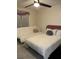 Cozy bedroom featuring a ceiling fan and comfortable bedding at 306 Clermont Dr, Kissimmee, FL 34759