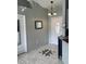 Welcoming foyer with decorative tile flooring and stylish lighting fixture at 306 Clermont Dr, Kissimmee, FL 34759