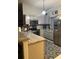 Well-equipped kitchen with stainless steel appliances, granite countertops, and ample cabinet space at 306 Clermont Dr, Kissimmee, FL 34759
