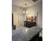 Kitchen island with granite countertop and additional seating, perfect for casual dining at 306 Clermont Dr, Kissimmee, FL 34759