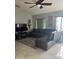 Comfortable living room with vaulted ceilings, tile floors, and plenty of natural light at 306 Clermont Dr, Kissimmee, FL 34759