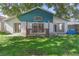 This home has a wood deck in the partially fenced backyard with sliding doors to the house at 3228 Fairfield Dr, Kissimmee, FL 34743