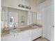 Bright bathroom with dual sinks, ample counter space, large mirror, and vanity with storage at 3228 Fairfield Dr, Kissimmee, FL 34743
