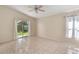 This bedroom is filled with natural light and has sliding glass doors to the yard at 3228 Fairfield Dr, Kissimmee, FL 34743