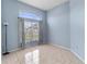 This bedroom has natural lighting, and tiled floor at 3228 Fairfield Dr, Kissimmee, FL 34743