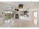 Well lit dining room featuring tile flooring, modern lighting and glass sliding door at 3228 Fairfield Dr, Kissimmee, FL 34743