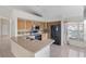 Well-lit kitchen features stainless steel appliances, wood cabinetry, and light countertops at 3228 Fairfield Dr, Kissimmee, FL 34743