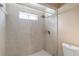 Shower stall features tiled surround and shower head at 3228 Fairfield Dr, Kissimmee, FL 34743