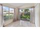 Sunroom offers natural light with sliding glass doors leading to the backyard at 3228 Fairfield Dr, Kissimmee, FL 34743