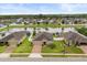 Beautiful aerial view of a home on a large lot with a lake view and well manicured backyard at 3797 Briarwood Estates Cir, St Cloud, FL 34772