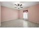 Bedroom featuring tiled floors, neutral walls, and a ceiling fan at 3797 Briarwood Estates Cir, St Cloud, FL 34772