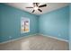 Bright bedroom with light, tiled floors, a ceiling fan, and a view from the window at 3797 Briarwood Estates Cir, St Cloud, FL 34772
