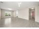 Spacious living room with gray tile floors, neutral paint, and views into the front yard at 3797 Briarwood Estates Cir, St Cloud, FL 34772