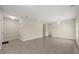 Open living room with gray tile floors, neutral paint, and views to other parts of the house at 3797 Briarwood Estates Cir, St Cloud, FL 34772