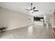 Open-concept living room featuring dark cabinets, granite counters, and stainless steel appliances at 3797 Briarwood Estates Cir, St Cloud, FL 34772