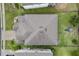 Aerial view of the home showing the roof, backyard, and surrounding fence lines at 3853 Cortland Dr, Davenport, FL 33837