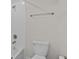 Bright white bathroom featuring white tiled walls, modern fixture and a clean aesthetic at 3853 Cortland Dr, Davenport, FL 33837