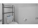 Powder room with a toilet and shelf, showcasing modern fixtures and a clean aesthetic at 3853 Cortland Dr, Davenport, FL 33837