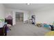 Large upstairs bonus room with neutral walls and an open view to the downstairs landing at 3853 Cortland Dr, Davenport, FL 33837