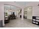 Open-concept dining area featuring tile floors, modern lighting, and seamless transitions to other living spaces at 3853 Cortland Dr, Davenport, FL 33837