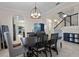 Dining room featuring a dark wood table with seating for six and decorative lighting at 3853 Cortland Dr, Davenport, FL 33837
