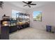 Bright room featuring many animals in enclosures, tile flooring, and a ceiling fan at 3853 Cortland Dr, Davenport, FL 33837