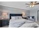 Comfortable main bedroom featuring a cozy sitting area, soft carpeting, and a relaxing ambiance at 3853 Cortland Dr, Davenport, FL 33837