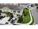 An aerial view of a two-story home, showcasing its driveway, green lawn, and proximity to the neighborhood at 403 Arbor Lakes Dr, Davenport, FL 33896