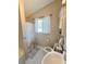Bathroom featuring a tub/shower combo, a window with bright light, and tiled floors for a clean and updated look at 4151 Nelson Rd, Lake Wales, FL 33898
