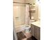 Cozy bathroom featuring a shower, toilet and vanity, complete with a matching gray rug at 4151 Nelson Rd, Lake Wales, FL 33898