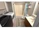 Bathroom with laundry featuring vanity, toilet, shower, washer and dryer for convenience at 4151 Nelson Rd, Lake Wales, FL 33898