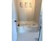 Bathroom featuring a large soaking tub, tile floors, and modern fixtures, perfect for relaxation at 4151 Nelson Rd, Lake Wales, FL 33898