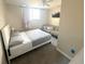 Serene bedroom with a cozy sofa for relaxing, complemented by soft lighting and a comfortable bed at 4151 Nelson Rd, Lake Wales, FL 33898
