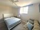 Bedroom featuring neutral tones, a comfortable bed, and a cozy sofa for a relaxing retreat at 4151 Nelson Rd, Lake Wales, FL 33898