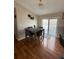 Cozy dining area featuring hardwood floors, sliding glass door and modern decor at 4151 Nelson Rd, Lake Wales, FL 33898