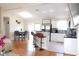 Open-concept kitchen and dining area featuring updated appliances and breakfast bar seating at 4151 Nelson Rd, Lake Wales, FL 33898
