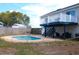 Backyard pool with an elevated deck and staircase, perfect for outdoor entertaining and relaxation at 4151 Nelson Rd, Lake Wales, FL 33898