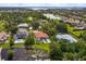 Stunning aerial view of estate featuring a pool, red tile roof, and meticulously landscaped grounds at 4224 Clarice Estates Dr, Windermere, FL 34786