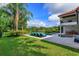 Manicured backyard with inviting pool, jacuzzi, and lounge chairs overlooking expansive lawn at 4224 Clarice Estates Dr, Windermere, FL 34786