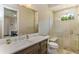 Beautiful bathroom featuring modern vanity, walk-in shower, and serene neutral tones at 4224 Clarice Estates Dr, Windermere, FL 34786