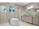 Luxurious bathroom with dual vanities, soaking tub, and two separate walk-in showers at 4224 Clarice Estates Dr, Windermere, FL 34786