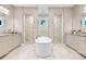 Spacious bathroom with dual vanities, a soaking tub, and separate walk-in showers at 4224 Clarice Estates Dr, Windermere, FL 34786
