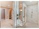 Stunning bathroom with a walk-in shower, soaking tub and beautiful marble-look tiling at 4224 Clarice Estates Dr, Windermere, FL 34786