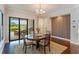 Charming dining area features a round table and a sliding glass door leading to the outdoor area at 4224 Clarice Estates Dr, Windermere, FL 34786