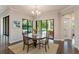 Bright dining room with views of the pool and outdoor space offers an inviting ambiance at 4224 Clarice Estates Dr, Windermere, FL 34786