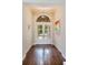 Inviting foyer showcasing hardwood floors, high ceilings, and a modern pendant light at 4224 Clarice Estates Dr, Windermere, FL 34786