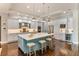 Spacious gourmet kitchen featuring a large center island, stainless steel appliances, and custom cabinetry at 4224 Clarice Estates Dr, Windermere, FL 34786
